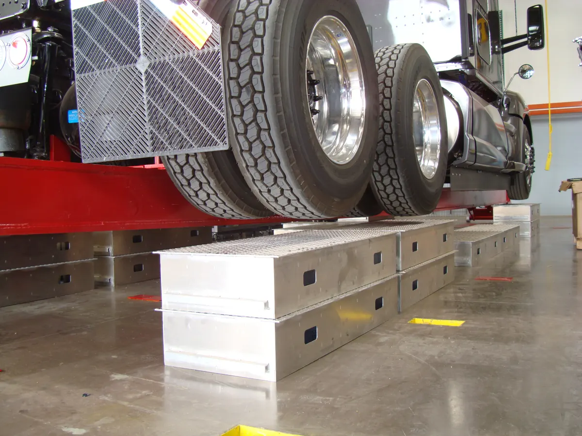 Truck tyres on alignment turn plates