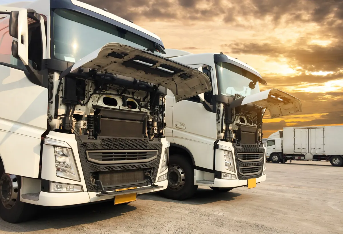 Trucks with tilted cabs ready for service